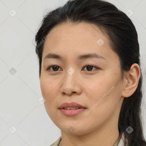 Joyful white young-adult female with long  brown hair and brown eyes