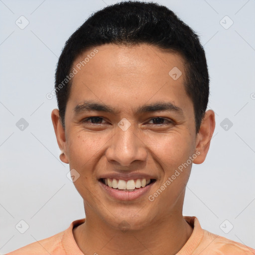 Joyful latino young-adult male with short  brown hair and brown eyes