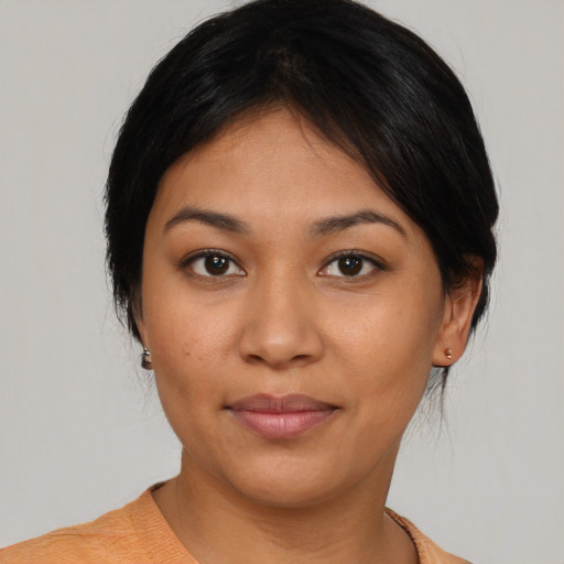 Joyful asian young-adult female with medium  black hair and brown eyes
