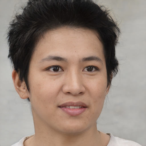 Joyful asian young-adult female with short  brown hair and brown eyes