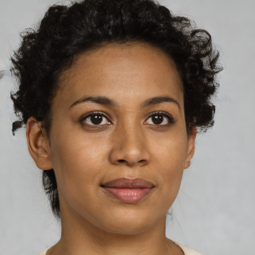 Joyful latino young-adult female with short  brown hair and brown eyes