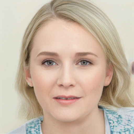 Joyful white young-adult female with medium  brown hair and blue eyes