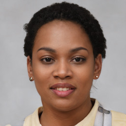 Joyful black young-adult female with short  black hair and brown eyes