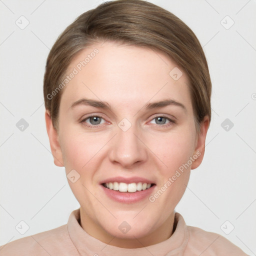 Joyful white young-adult female with short  brown hair and grey eyes