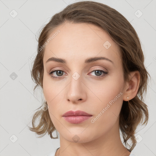 Neutral white young-adult female with medium  brown hair and grey eyes