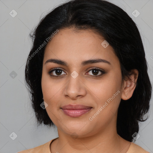 Joyful latino young-adult female with medium  black hair and brown eyes