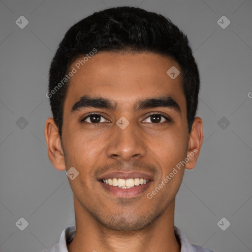 Joyful latino young-adult male with short  black hair and brown eyes