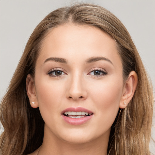 Joyful white young-adult female with long  brown hair and grey eyes