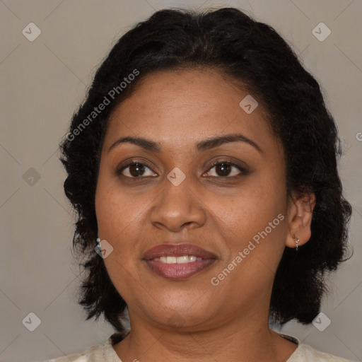Joyful latino adult female with medium  brown hair and brown eyes