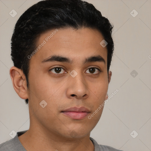 Neutral latino young-adult male with short  brown hair and brown eyes