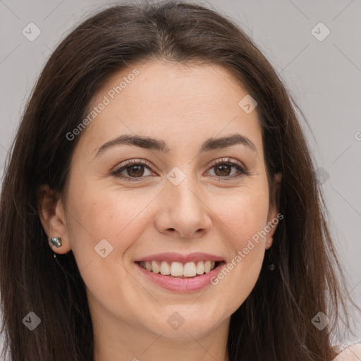 Joyful white young-adult female with long  brown hair and brown eyes