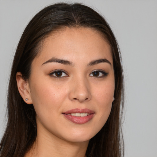 Joyful white young-adult female with long  brown hair and brown eyes