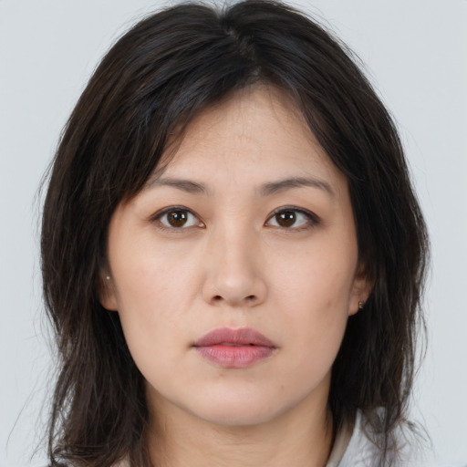 Neutral asian young-adult female with long  brown hair and brown eyes