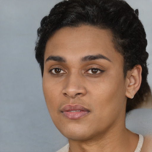 Joyful latino young-adult female with short  black hair and brown eyes