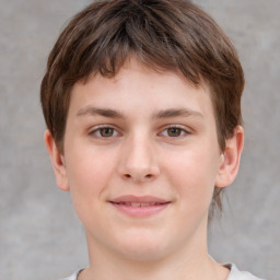 Joyful white child male with short  brown hair and brown eyes