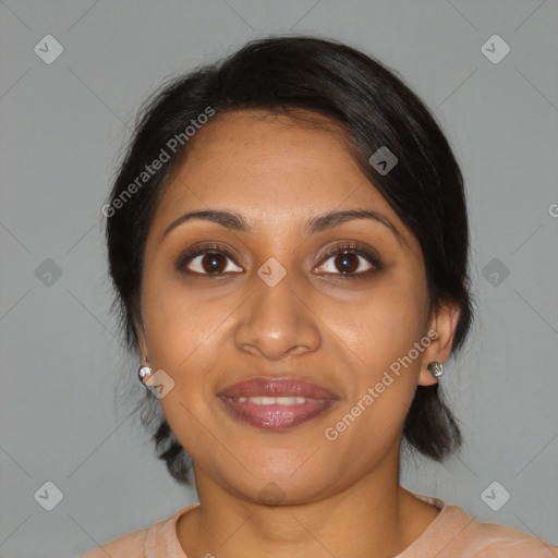 Joyful black young-adult female with medium  brown hair and brown eyes