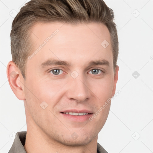 Joyful white young-adult male with short  brown hair and grey eyes