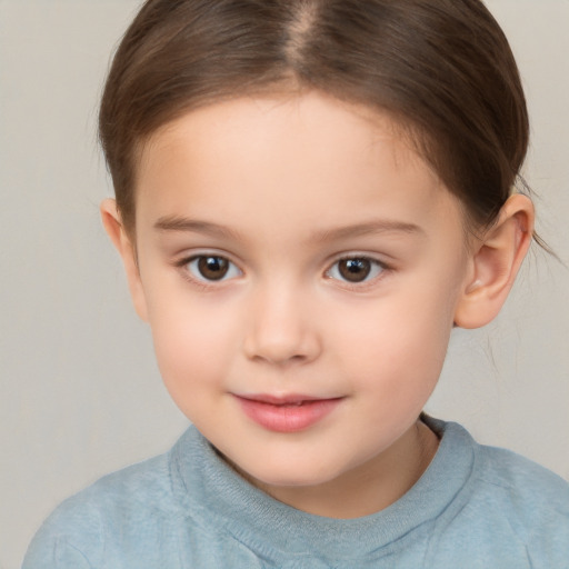 Joyful white child female with short  brown hair and brown eyes