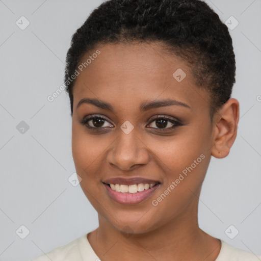 Joyful black young-adult female with short  brown hair and brown eyes