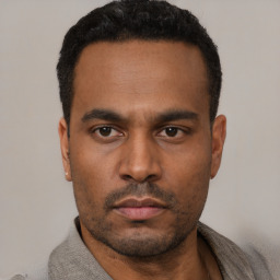 Neutral latino young-adult male with short  black hair and brown eyes