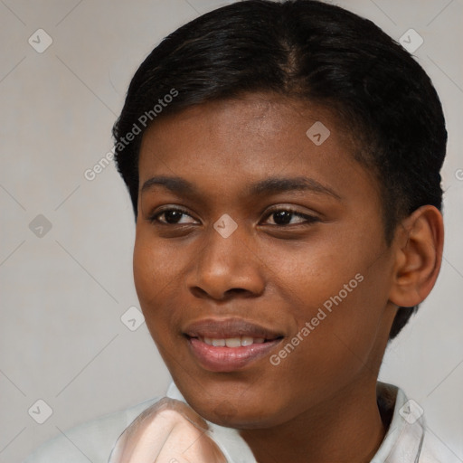 Joyful black young-adult female with short  brown hair and brown eyes