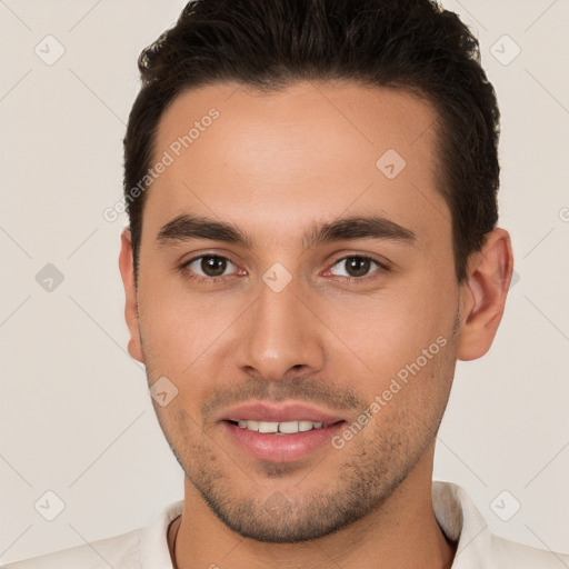 Joyful white young-adult male with short  brown hair and brown eyes