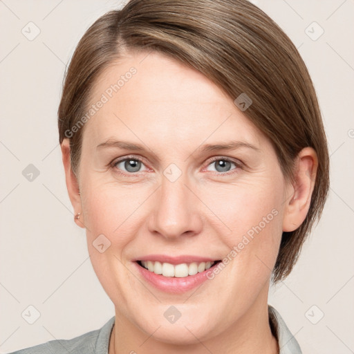 Joyful white adult female with medium  brown hair and grey eyes