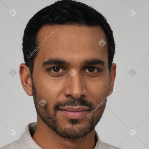 Joyful black young-adult male with short  brown hair and brown eyes