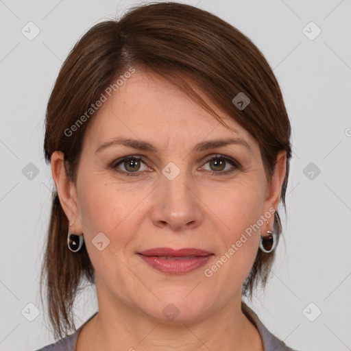 Joyful white adult female with medium  brown hair and grey eyes