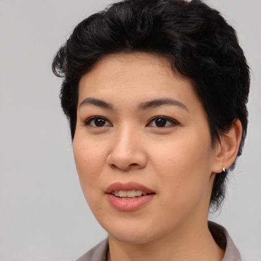 Joyful asian young-adult female with medium  black hair and brown eyes