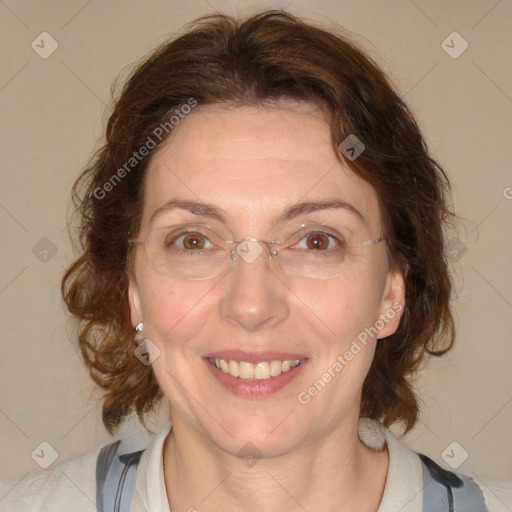 Joyful white adult female with medium  brown hair and blue eyes