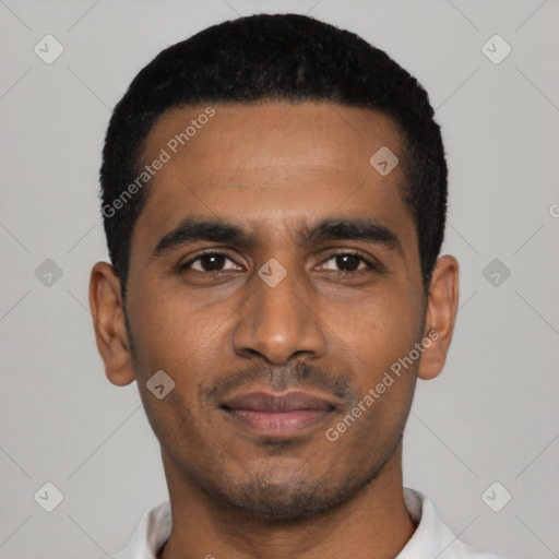 Joyful black young-adult male with short  black hair and brown eyes