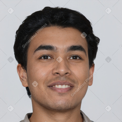 Joyful latino young-adult male with short  black hair and brown eyes