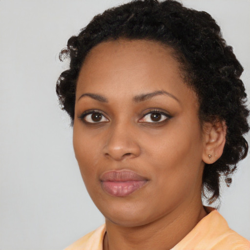 Neutral black young-adult female with medium  black hair and brown eyes