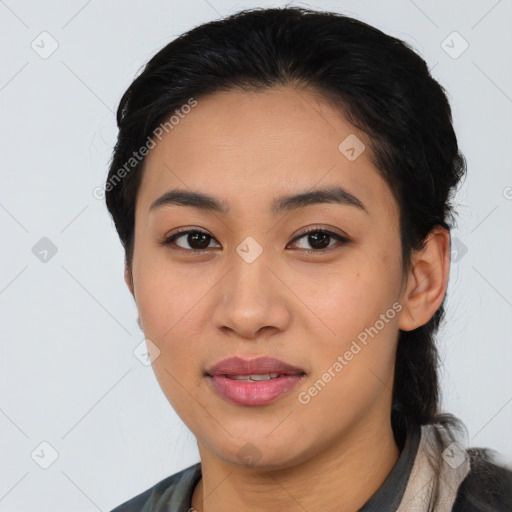 Joyful asian young-adult female with medium  brown hair and brown eyes