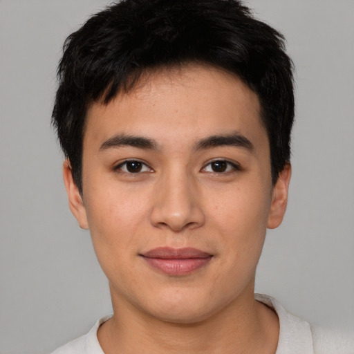 Joyful asian young-adult male with short  brown hair and brown eyes
