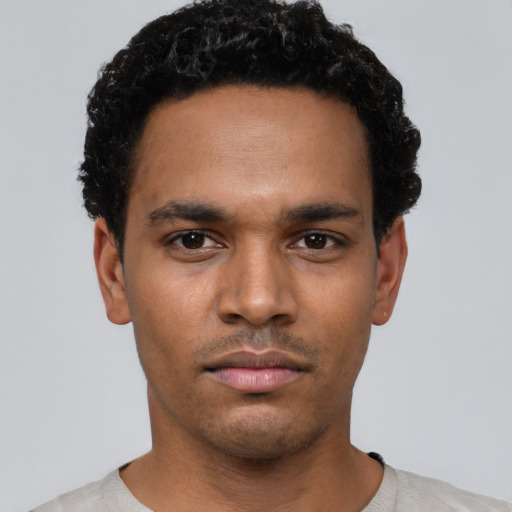 Neutral black young-adult male with short  black hair and brown eyes
