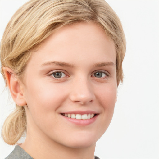 Joyful white young-adult female with medium  brown hair and blue eyes