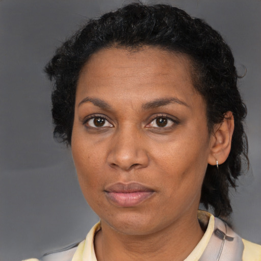Neutral black adult female with short  brown hair and brown eyes