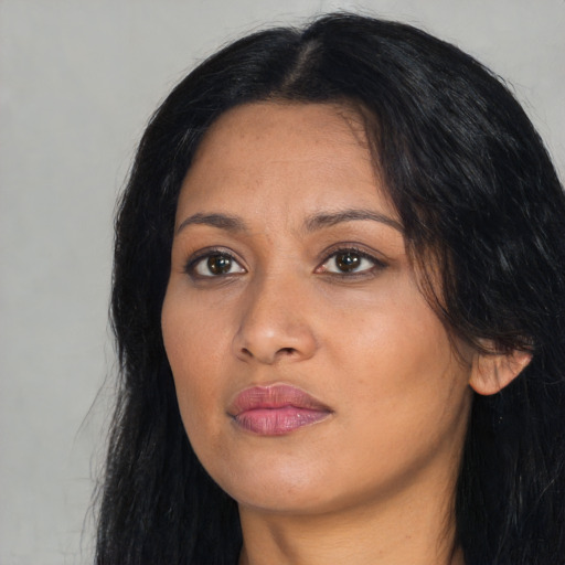 Neutral latino young-adult female with long  black hair and brown eyes