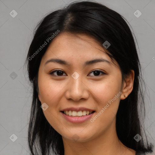 Joyful asian young-adult female with long  brown hair and brown eyes