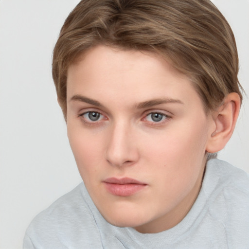 Neutral white young-adult female with short  brown hair and brown eyes