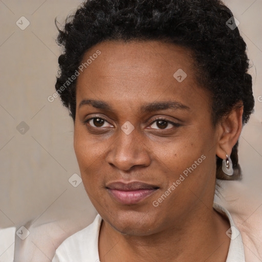 Joyful black young-adult female with short  black hair and brown eyes