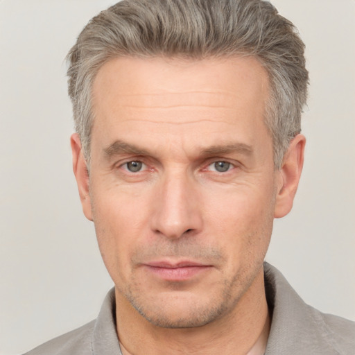 Neutral white adult male with short  brown hair and grey eyes