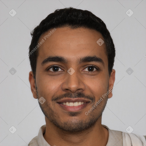 Joyful latino young-adult male with short  black hair and brown eyes