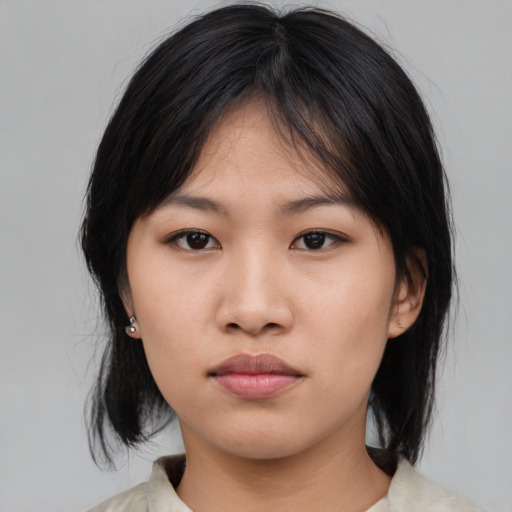 Neutral asian young-adult female with medium  black hair and brown eyes