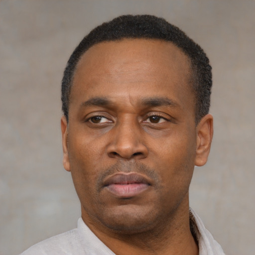 Neutral latino adult male with short  black hair and brown eyes