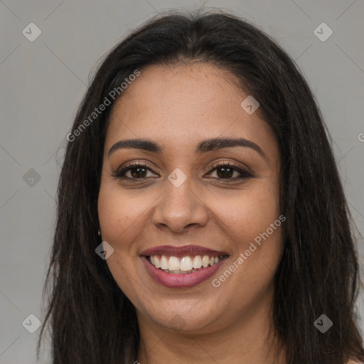 Joyful latino young-adult female with long  brown hair and brown eyes