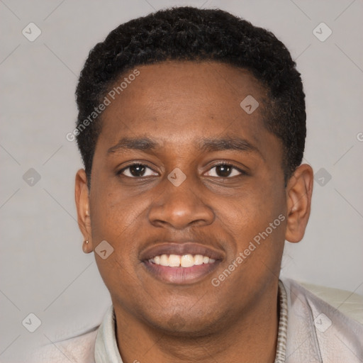 Joyful latino young-adult male with short  brown hair and brown eyes