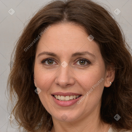 Joyful white adult female with long  brown hair and brown eyes